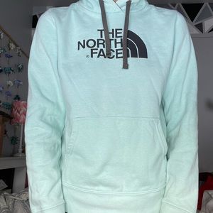 Mint colored North Face hoodie w/ dark grey logo. Inside of hood is dark grey.